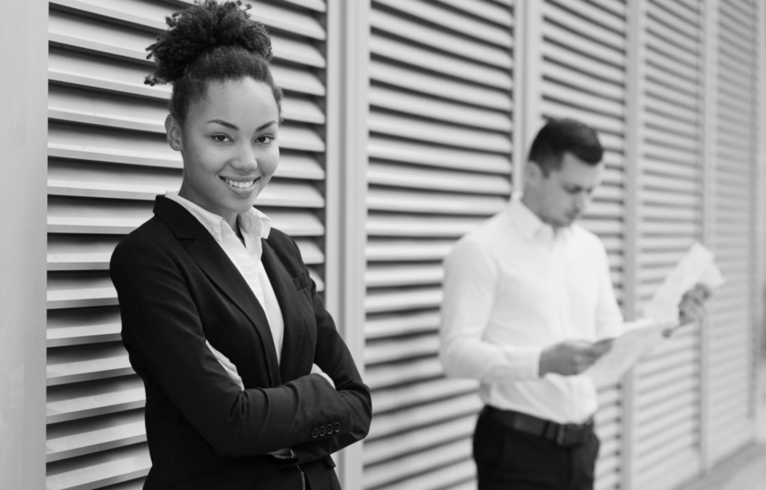 Instructor leading an engaging financial literacy workshop with participants taking notes